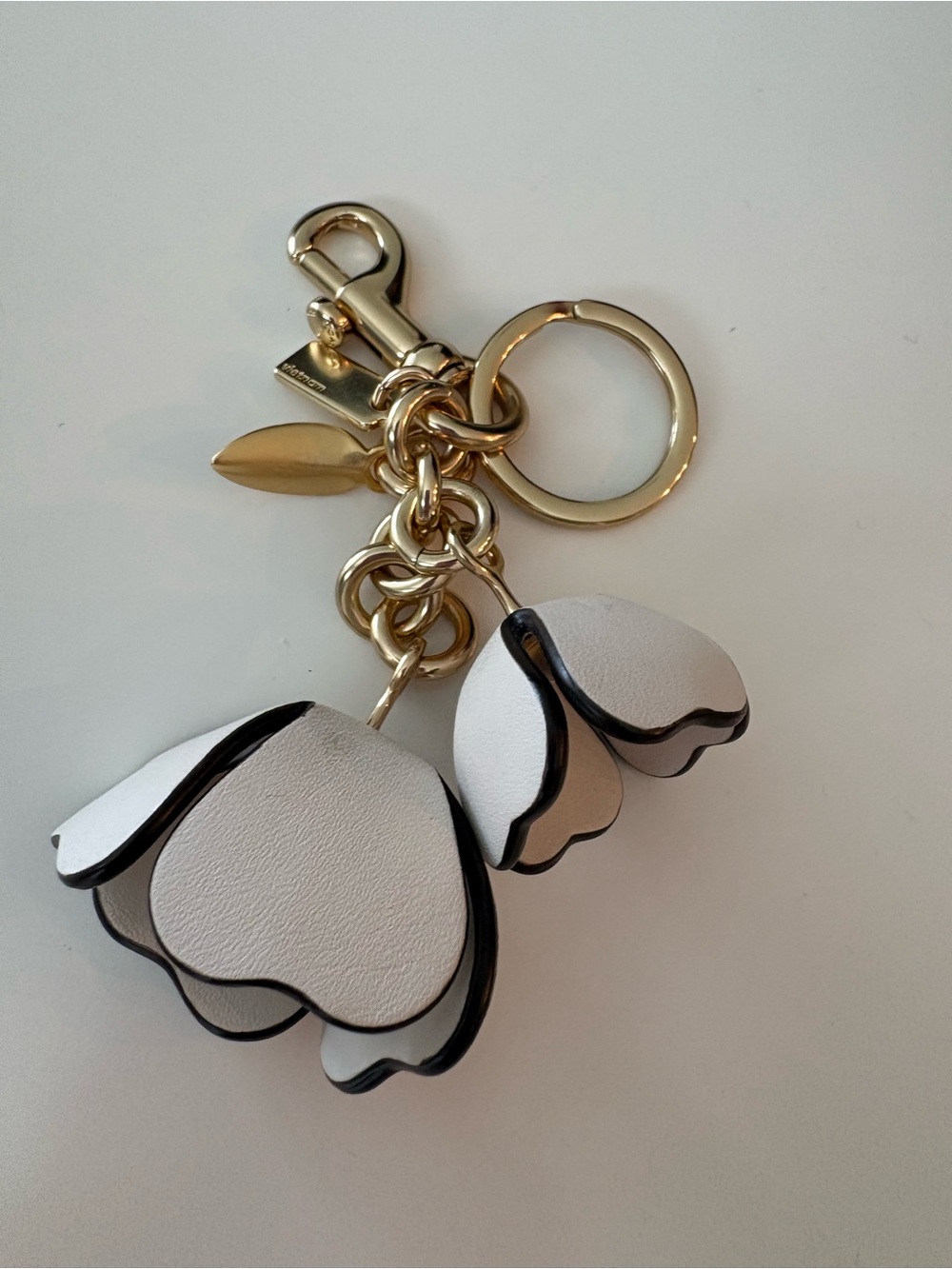 Coach Essential Tea Rose Bag Charm in gold and chalk - Picture 2 of 6